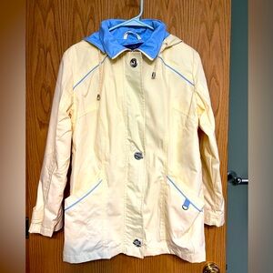 Pale yellow and blue rain jacket. Like new.